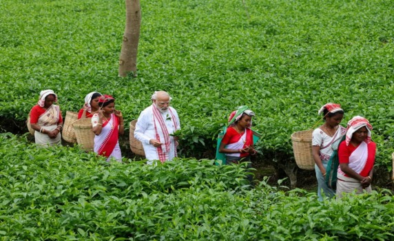 PM Narendra Modi spends time at tea garden in Dibrugarh.